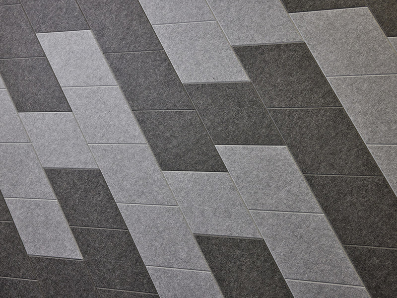 The Felt Right wall art design in shades of grey and black felt tiles creating a slanted look 