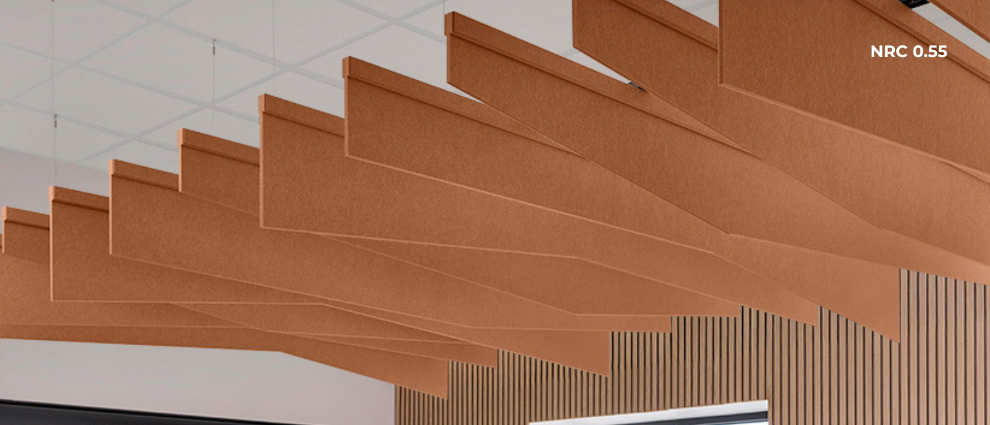 Brown acoustic panels on a wall with NRC 0.55 label