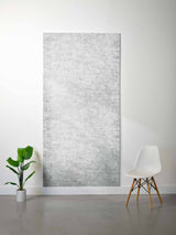 Light gray felt sheet with textured surface displayed vertically against white wall.