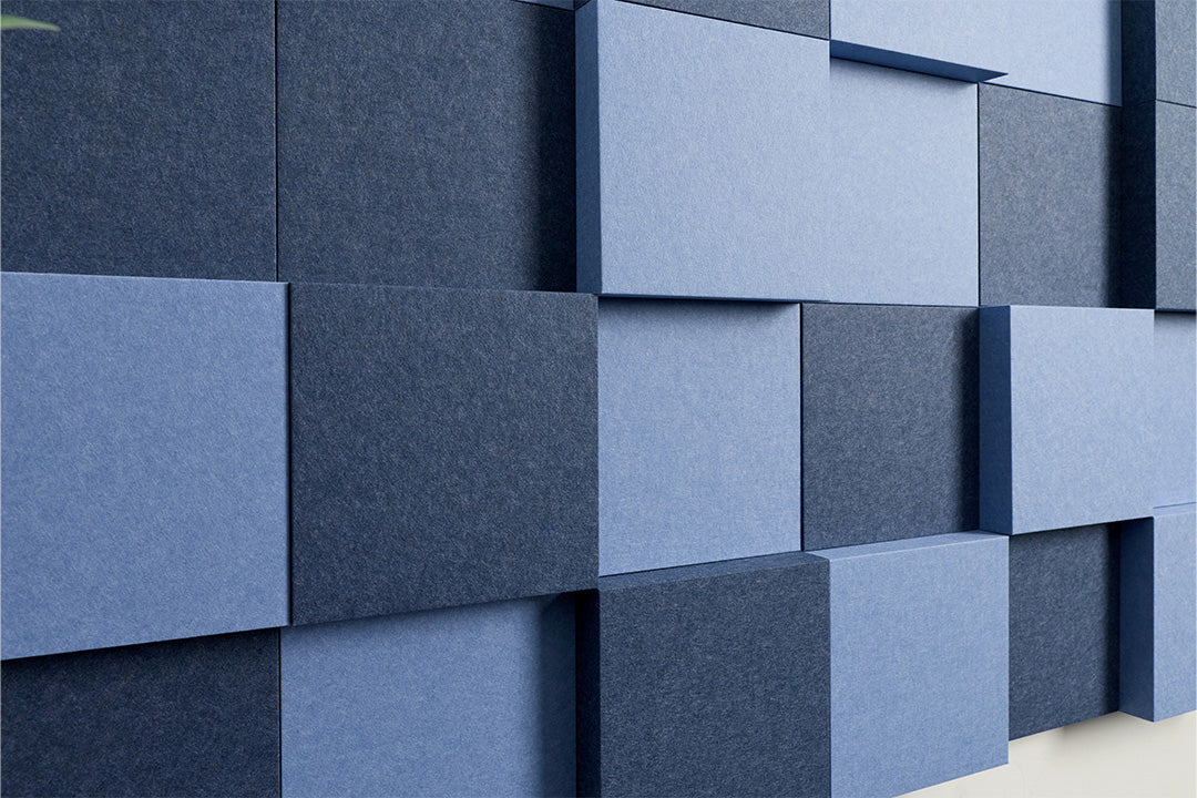 Blue square acoustic panels on a wall