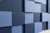 Blue square acoustic panels on a wall