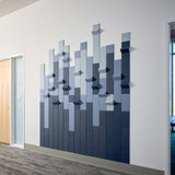 angled shot of blue wall art in a commercial hallway