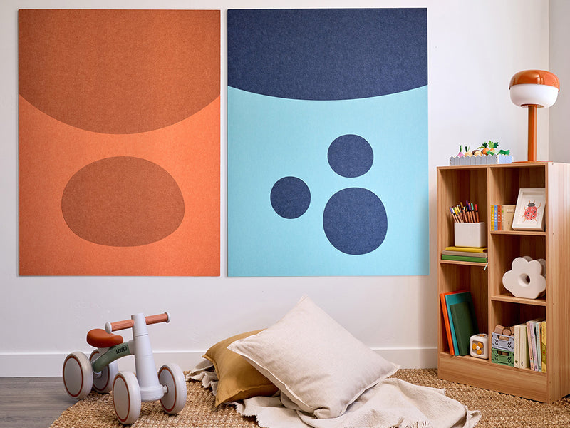 Children's room with abstract wall art, toys, and a bookshelf. Orange, blue wall art for kids room. Bluey and Bingo Jumbo Wall art.