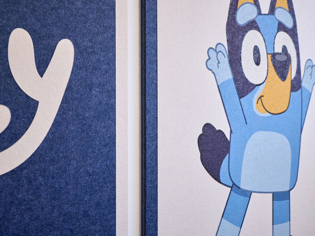 Bluey character on a felt tile on the wall