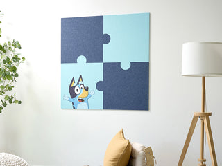 Jigsaw puzzle wall art with a Bluey the dog in a living room setting, light blue, dark blue design. DIY, easy, sticks to wall.