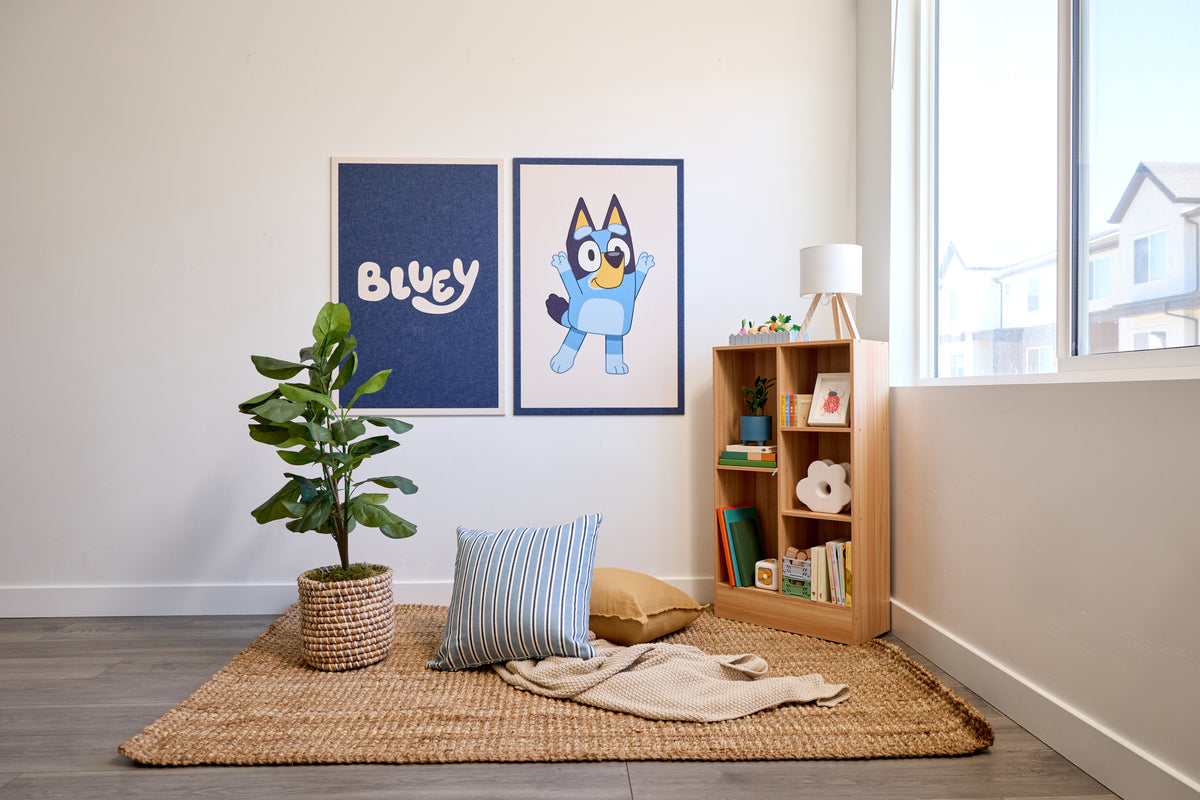 Colorful felt wall art design of popular cartoon characters in a midcentury modern living room