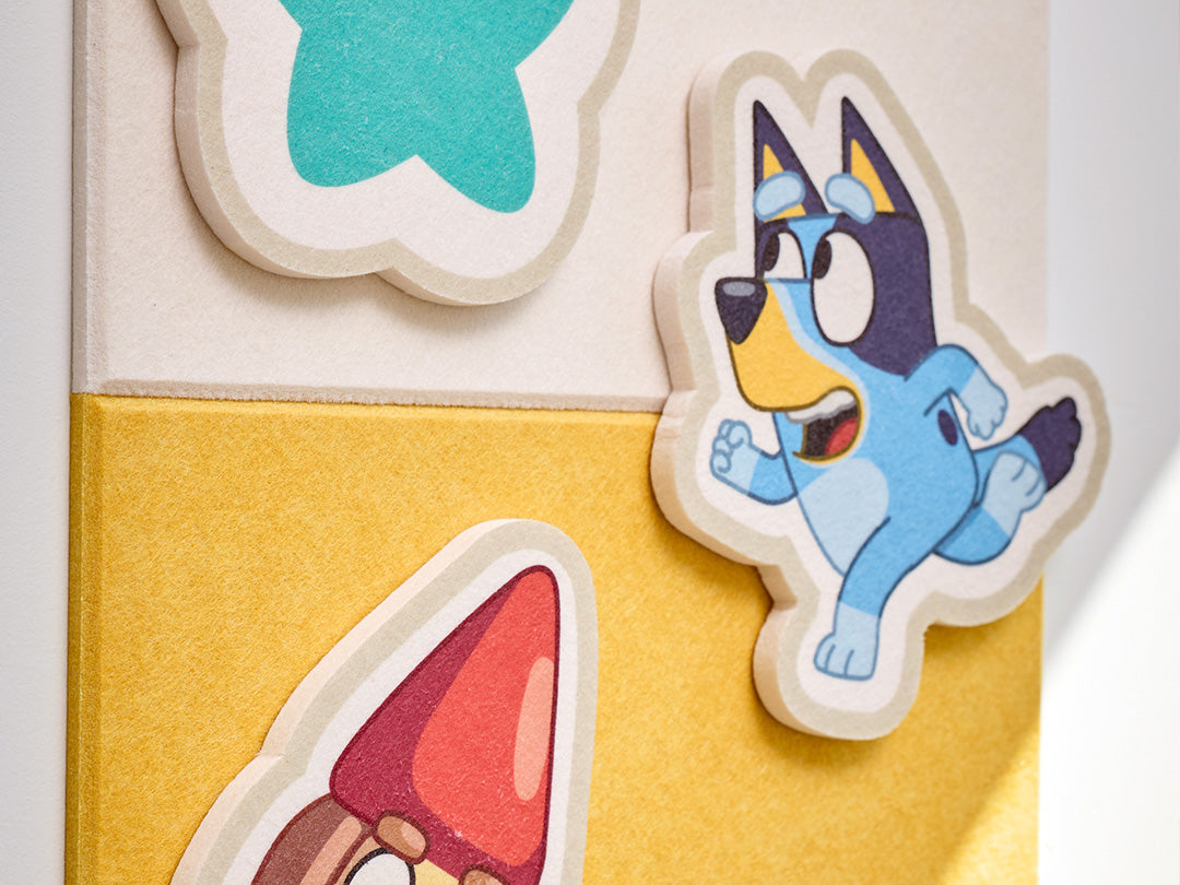 Colorful children's Bluey wall art with yellow felt tile. 