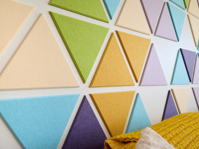 Colorful geometric triangle tiles on a white background