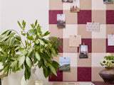 Burgundy gingham patterned pinboard made from acoustic felt tiles