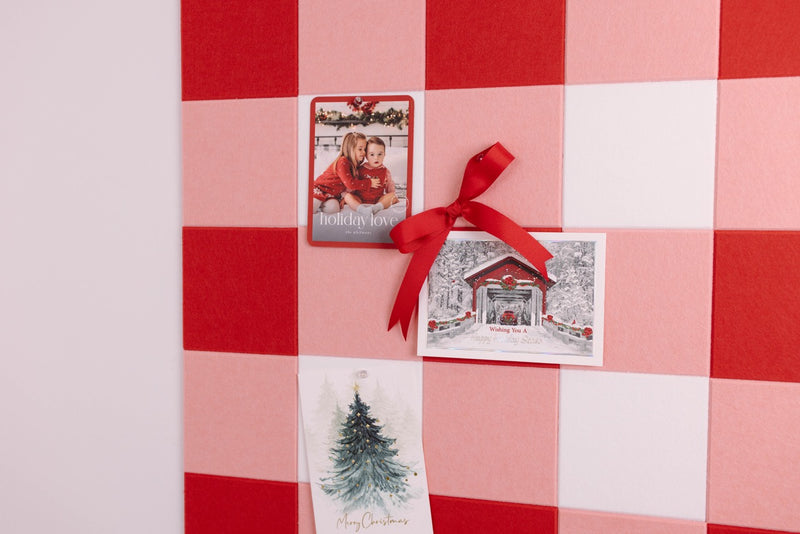 Christmas cards on a red and white checkered background