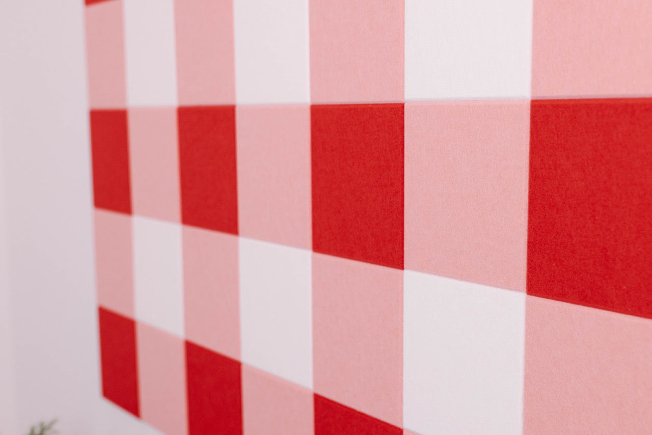 Red and white checkered pattern on a felt right pinboard