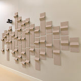 Tan felt acoustic tiles with points of dimension to create a modern design