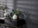 A Felt Right wall art design in a dark shade of grey on a kitchen wall next to a dinning table