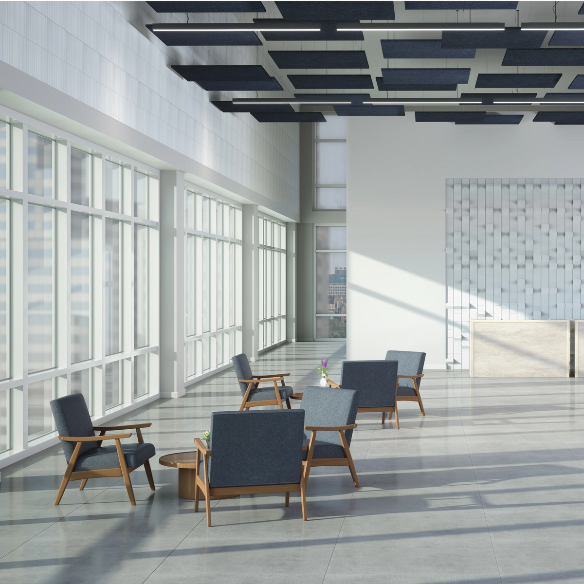 A modern, sunlit office lobby with several blue upholstered wooden armchairs arranged around small round tables. Large floor-to-ceiling windows line the left side, casting strong shadows across the tiled floor.