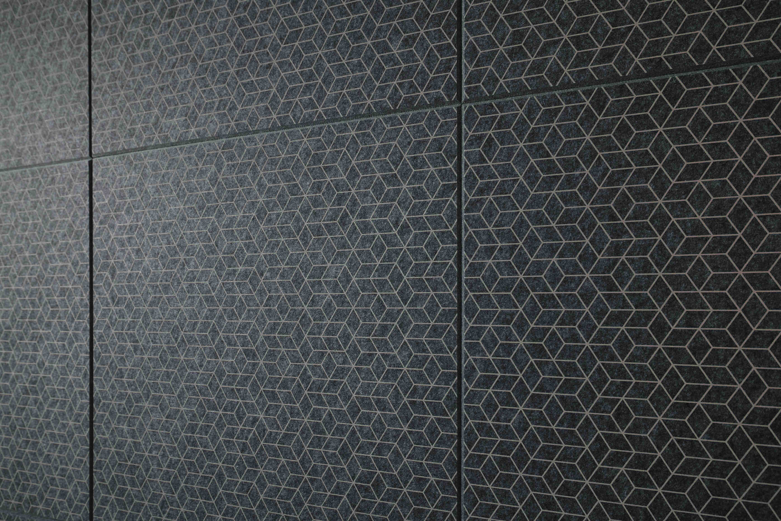 Patterned black tiles on a wall