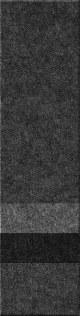A felt tile that is dark gray on the top, lighter gray, black, and then a dark gray bottom. 