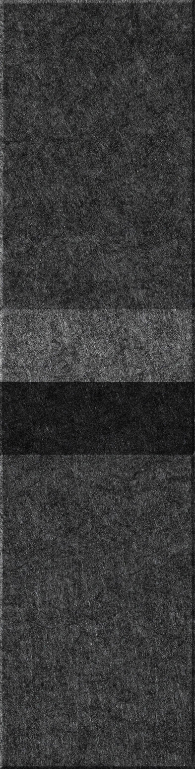 Stacked rectangular tiles in varying shades of gray and black with textured surfaces.