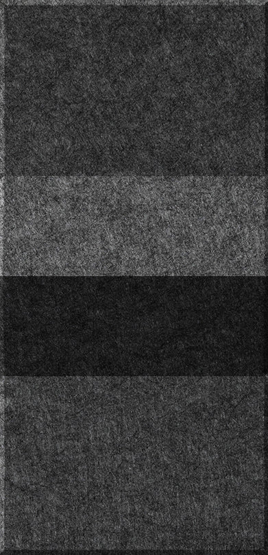 Four stacked rectangular tiles in varying shades of gray and charcoal with textured surfaces.