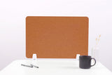 Brown desk divider with rounded corners and white supports on a white desk surface.
