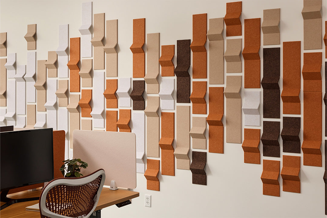 Peak dimensional products on an office wall in earth tones