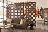 Decorative acoustic screen with geometric pattern in a workplace setting