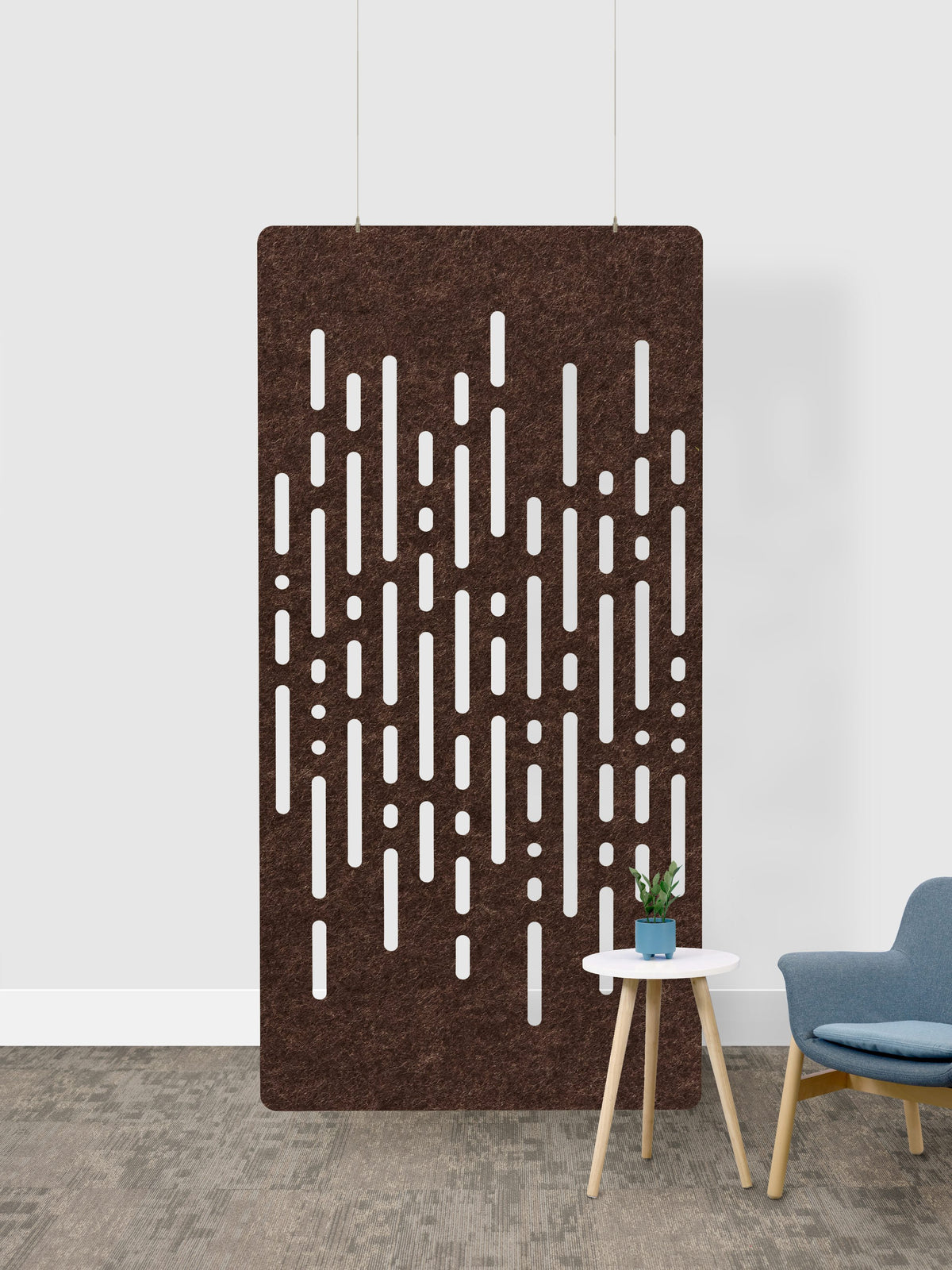Decorative wall acoustic felt panel panel with a geometric pattern in a room setting.