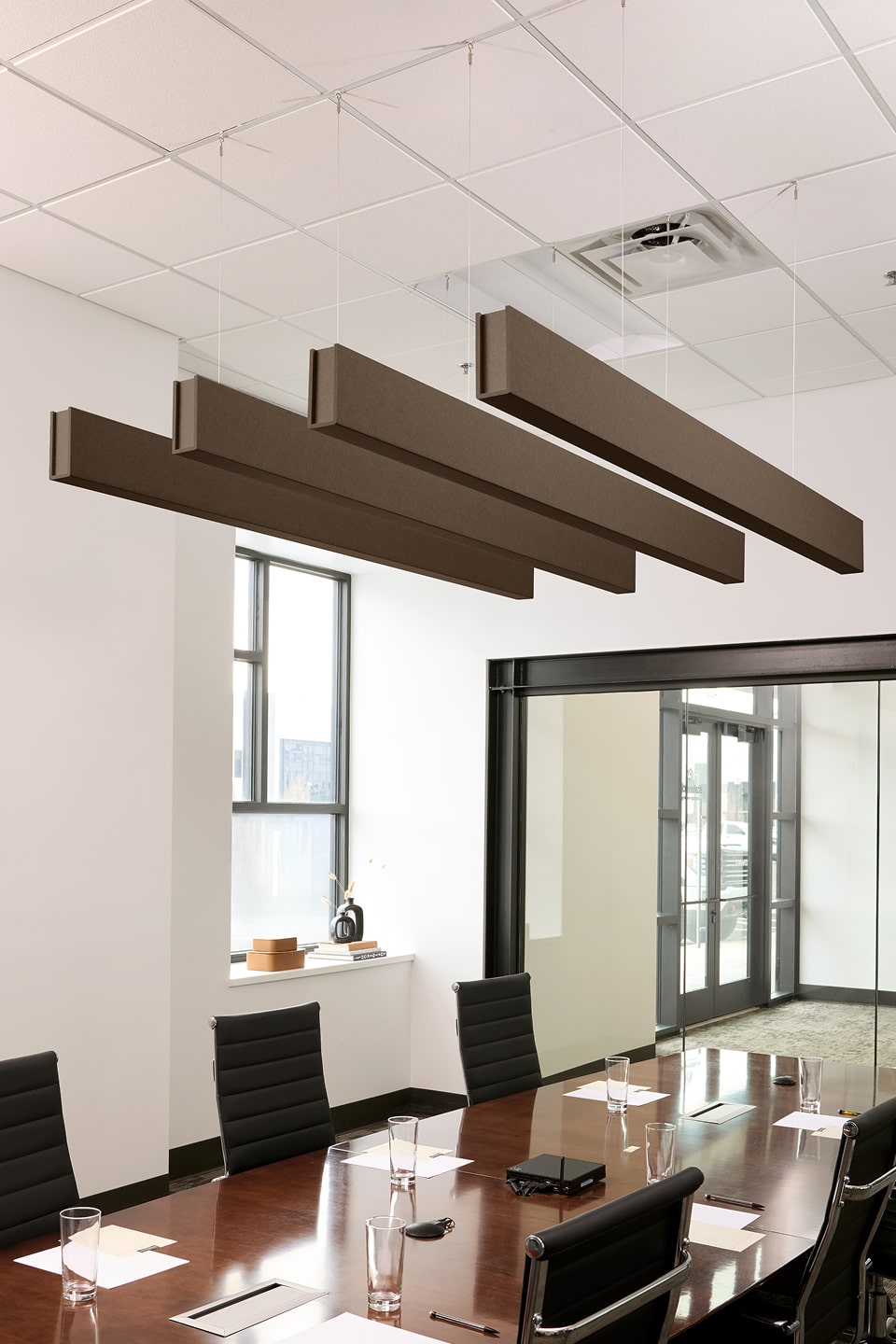 PET felt suspended acoustic beam in Cocoa by Felt Right absorbs unwanted noise and looks great in any setting. Available in four or eight foot lengths. Clips into ACT grid or drills into drywall ceiling.