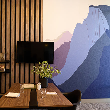 Modern office space featuring various neutral toned acoustic felt products