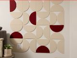 Modular wall panels with cream and burgundy semicircular tiles arranged in geometric pattern on white wall.