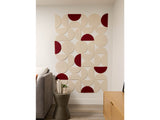 Modular wall art with cream and burgundy semicircle tiles arranged in geometric pattern on white wall.