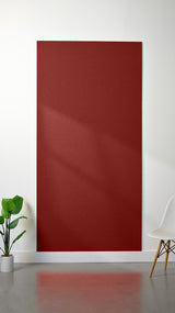 Burgundy felt sheet with smooth, uniform surface texture displayed on white wall.