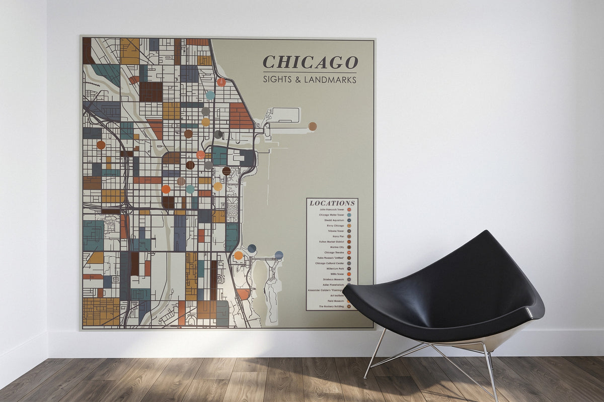 Printed directory wall art on white wall next to a black coconut chair.