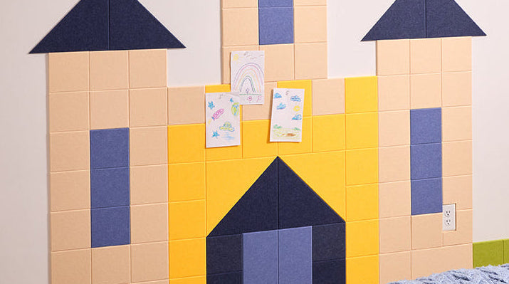Children's room with a castle-shaped wall decoration made of colorful acoustic tiles.