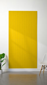 Large yellow felt sheet with evenly spaced parallel engraved lines throughout.