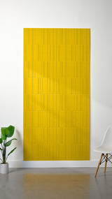 Bright yellow felt sheet with engraved linear pattern creating offset rectangular sections across the surface.