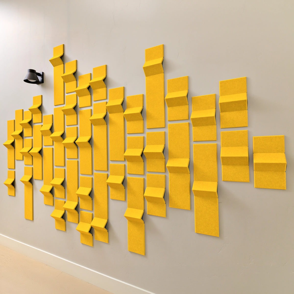 Yellow felt acoustic tiles with 3D points of dimension