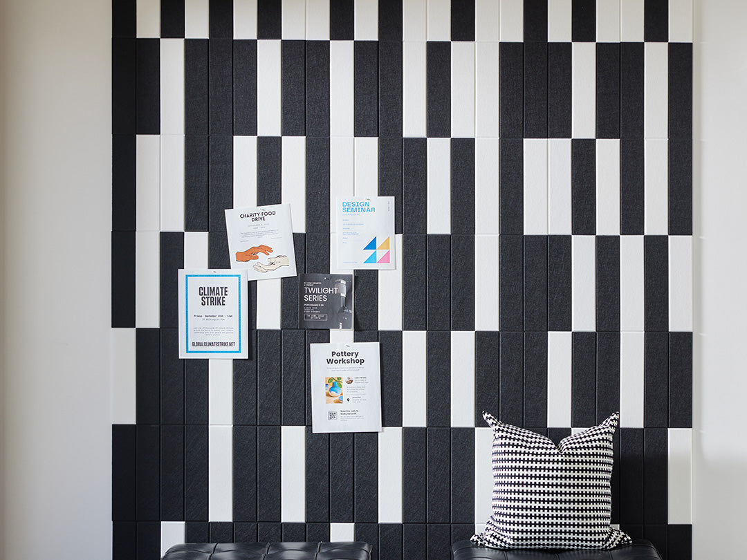 Felt Right wall art using black and white felt tiles to create a geometric pattern that is pinnable and on a white walls 