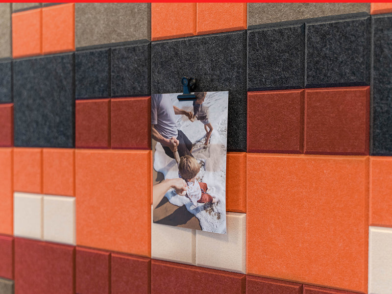 Colorful tiled wall with a photo of a couple holding hands.