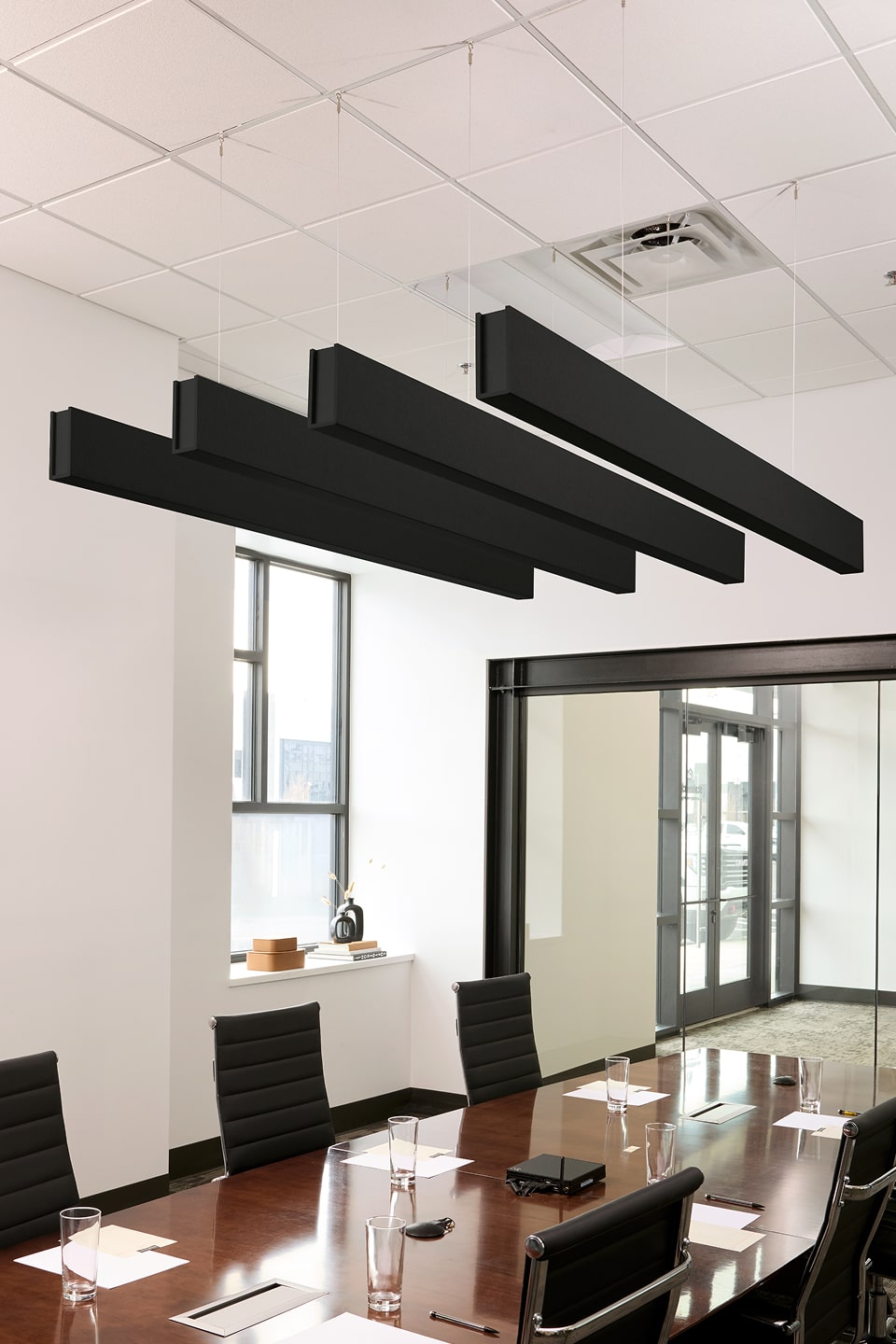 PET felt suspended acoustic beam in Ebony by Felt Right absorbs unwanted noise and looks great in any setting. Available in four or eight foot lengths. Clips into ACT grid or drills into drywall ceiling.
