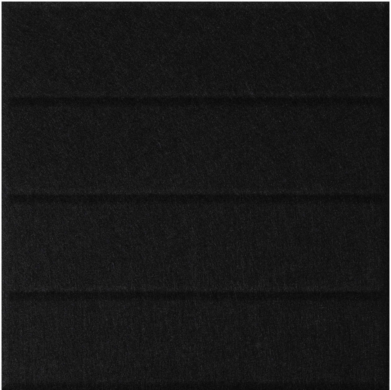 Black textured tile with horizontal parallel line divisions across surface.
