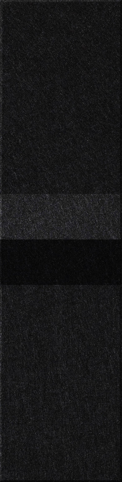 Black speckled rectangular tile with granular texture surface.