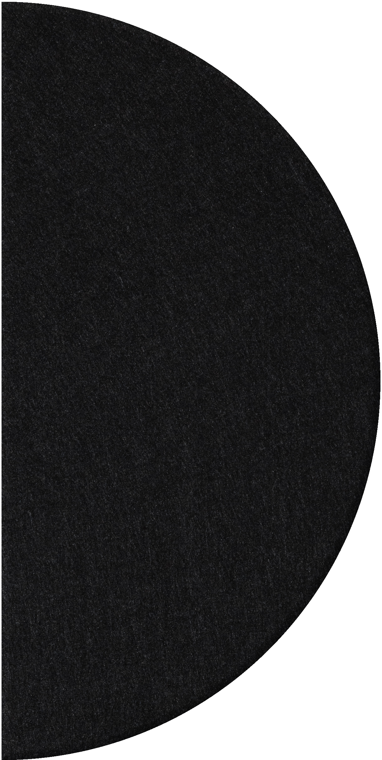 Black half-circle tile with textured speckled surface.
