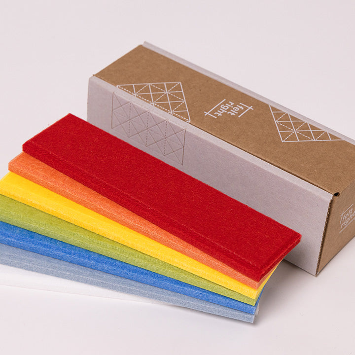 Primary color palette of felt samples with cardboard box