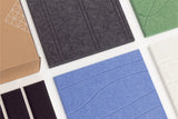 Set of five felt engraved samples in different colors on a white background