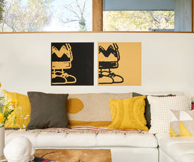 Far away shot of two Charlie Brown wall panels.