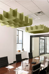 Green acoustic baffle panels suspended from drop ceiling above conference table in office space.