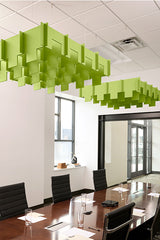 Lime green 3D modular acoustic baffles suspended from ceiling in office conference room.