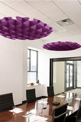 Purple 3D foil cloud baffles suspended from ceiling in modern office conference room.