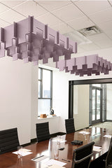 Purple 3D modular acoustic baffles suspended from ceiling in office meeting room above conference table.
