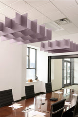 Mauve 3D grid acoustic baffles suspended from ceiling in office conference room above wooden table.
